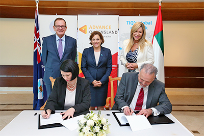 Gruntify CEO Jamie Leach and Duserve CEO Sam Taleb sign the MoU, witnessed by (back row from left) TIQ senior adviser Middle East Geoffrey Schuhkraft, Queensland Deputy Premier Jackie Trad, and Queensland Trade and Investment commissioner in the Middle East Donna Massie.