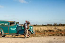 Neil Druce, founder of Junee Licorice and Chocolate Factory, on location with his vintage work van. The company's heritage and background in organic farming play major roles in the Junee chocolate story.