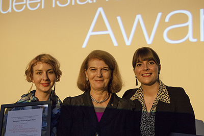 The previous State Library Queensland Business Leaders Hall of Fame Memory fellowship on Queensland's fashion industry has been completed by Madeleine King and Nadia Buick, pictured here being congratulated by former Governor, Penelope Wensley.