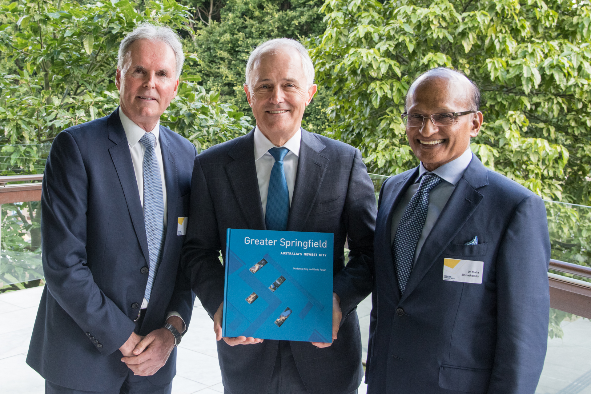 When Prime Minister Malcolm Turnbull (centre) cane to view Greater Springfield's success for himself, he also joined Bob Sharpless (left) and Maha Sinnathamby to launch a commemorative book on the development of the forward-focussed city.