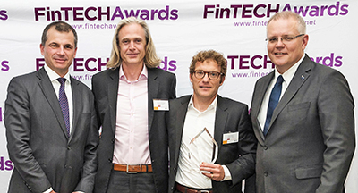 From left are PaulJenkins of Ashurst, Martin McCann and Mathias Bron of Trade Ledger with Prime Minister Scott Morrison at the awards ceremony.