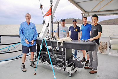 Wave Glider was deployed on the Great Barrier Reef from the AIMS research vessel, Cape Ferguson. From left are Scott Bainbridge of AIMS, Daniel Merritt and Ricardo Puig of Liquid Robotics, Boeing's Michael de La Chapelle and Shahmi Suhaimee also of Liquid Robotics.