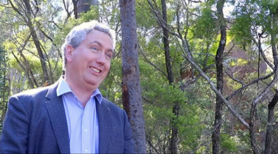Nigel Greenwood, leader of Team MachineGenes, which has made it through to the finals of IBM Watson's AI XPRIZE, is interviewed outside the company's base at the Long Pocket University of Queensland iLab complex in Brisbane.