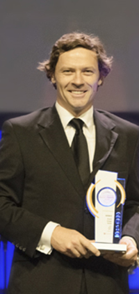 Shaun Munday with an earlier Place Design Group award, a 2012 Premier of Queensland Export Award.
