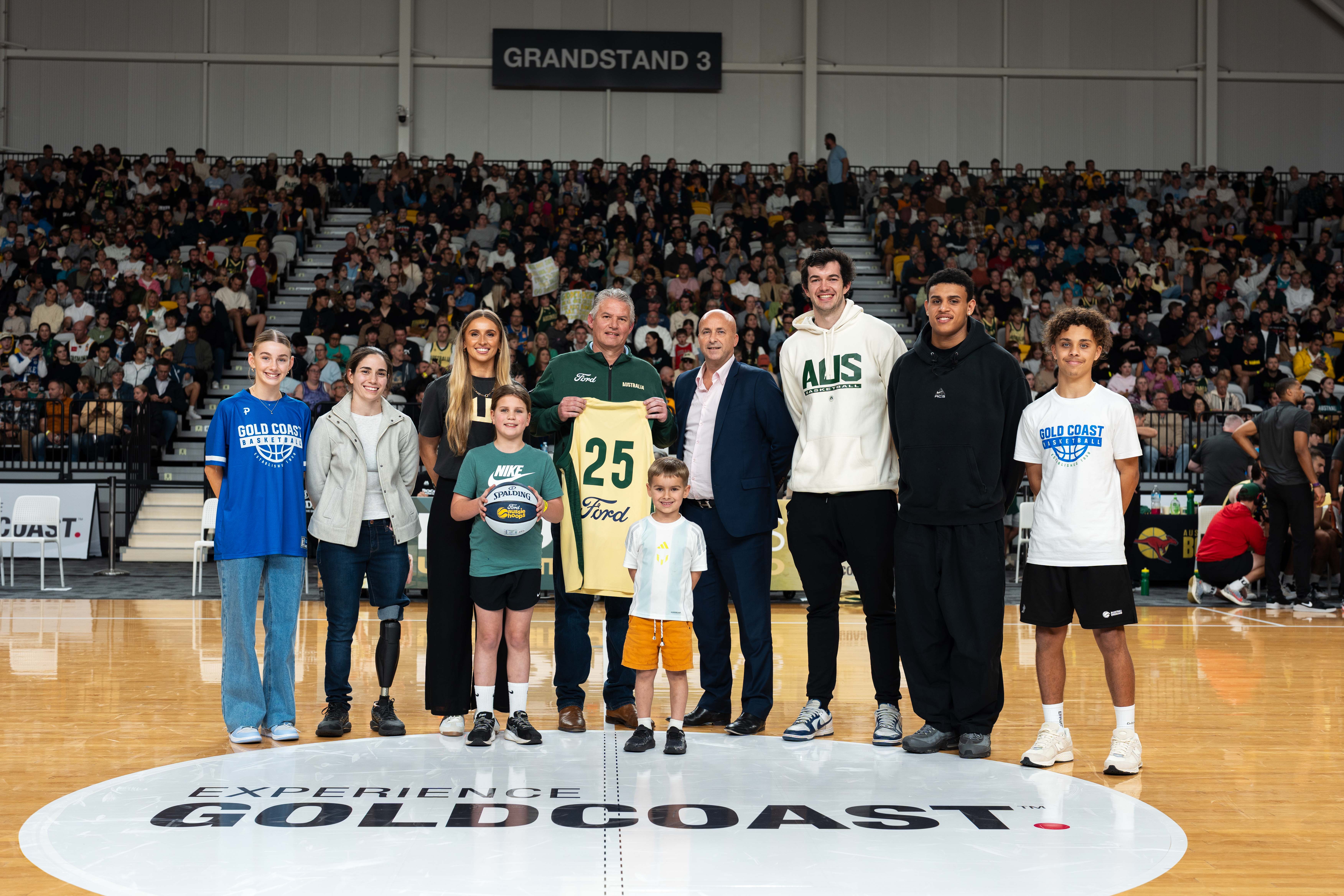 Basketball Australia and the Ford Dealer Network has extended its partnership. Celebrating this are Boomers players Jack White and Xavier Cooks with Basketball Australia CEO, Matt Scriven at a Gold Coast basketball carnival. Image: Basketball Australia.