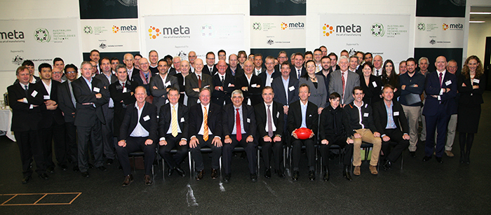 Members and supporters of the Sports Advanced Manufacturing Hub gather for a 'team shot' at the MCG launch event.