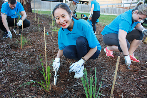 Kathy Lu takes part in Hilton's 100-tree planting exercise to mark the company's 100th anniversary.